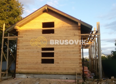 Дом 7х13 м с беседкой из обрезного бруса 150х200 мм в Московской области