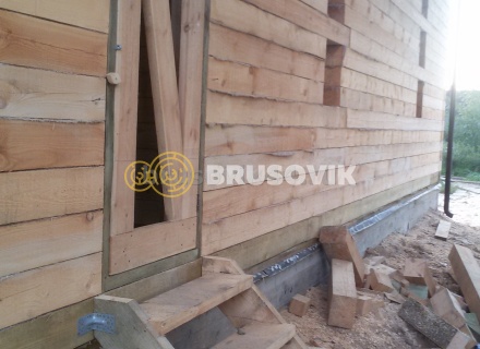 Дом 7х13 м с беседкой из обрезного бруса 150х200 мм в Московской области